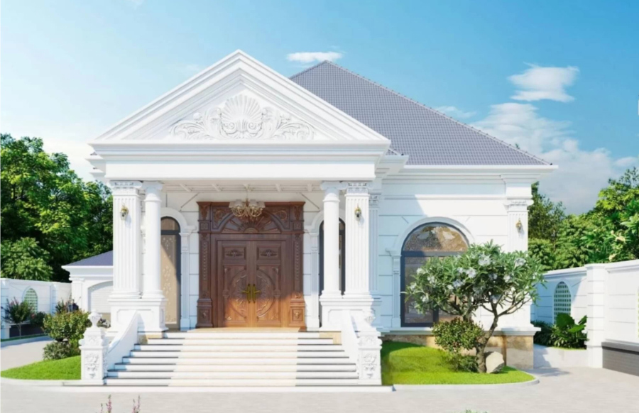 Mẫu nhà 1 tầng Tân Cổ Điển tráng lệ. Đại sảnh bề thế, cột trụ lớn và cửa gỗ tự nhiên tinh xảo. Tông trắng chủ đạo toát lên vẻ thanh lịch